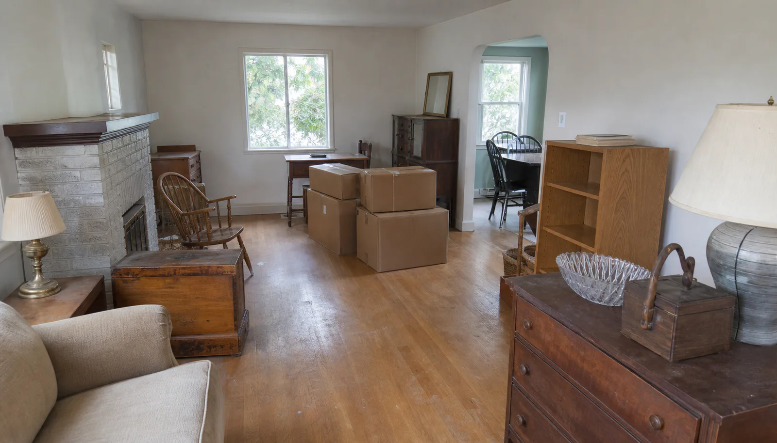Furniture and plain boxes arranged respectfully in a household room