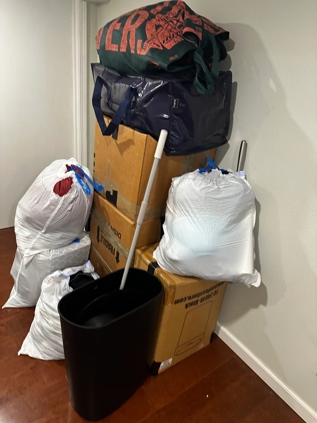 Bags and household items gathered inside during the move-out