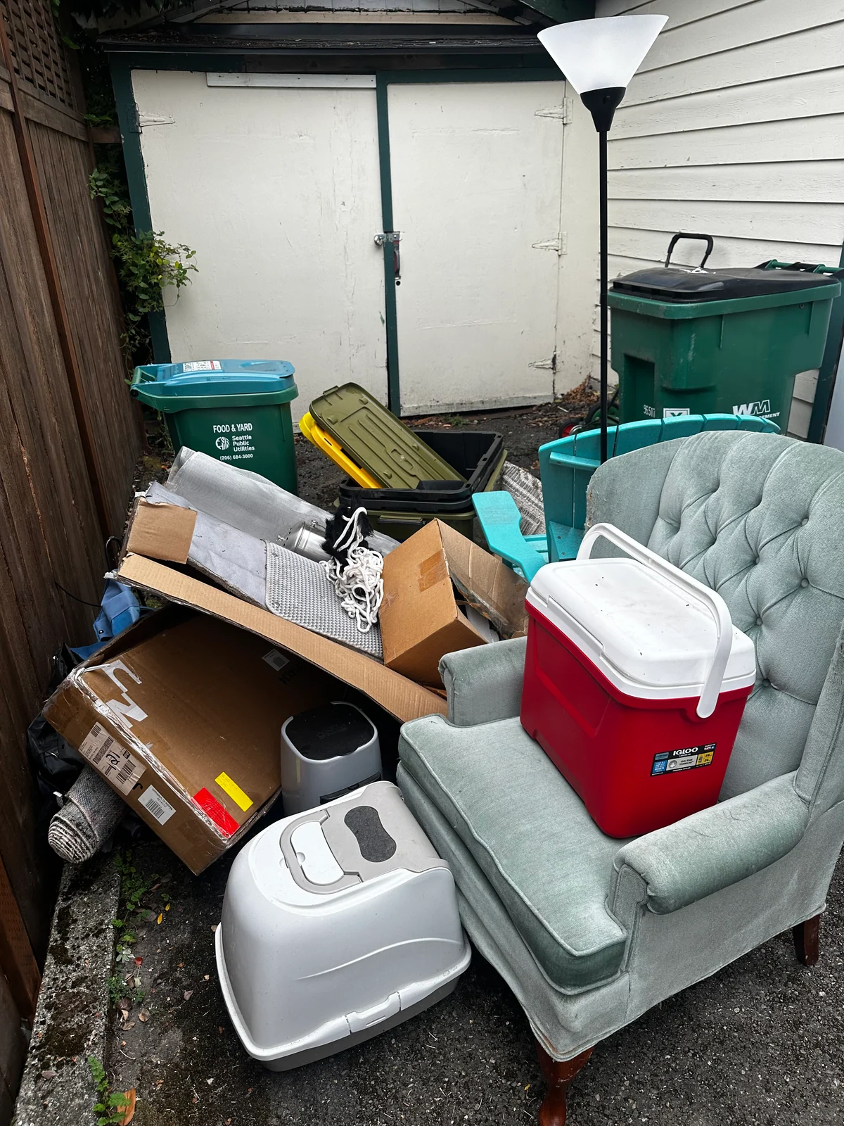 Furniture and household items gathered outside during a college move-out