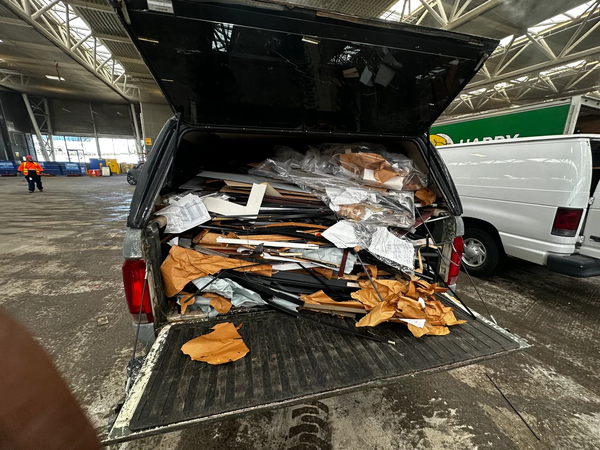 Removed frames and cardboard loaded in a pickup truck