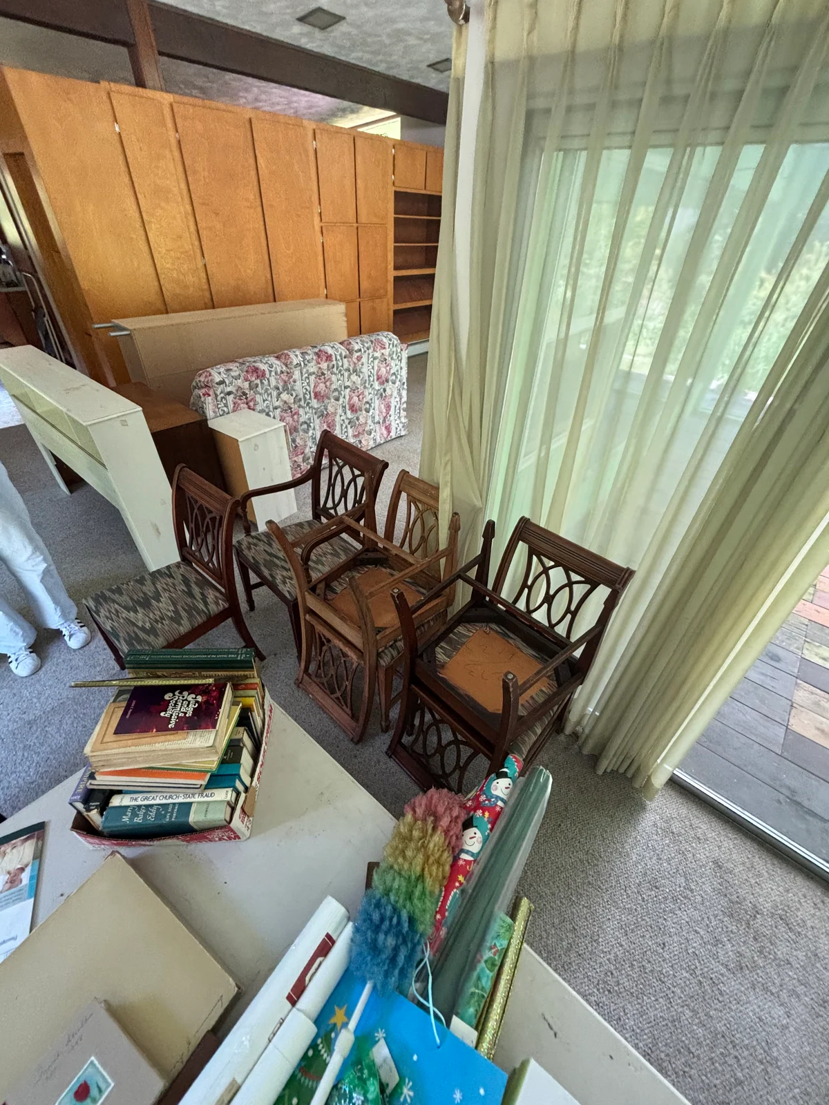 Chairs, cabinets, and household items grouped in the living room