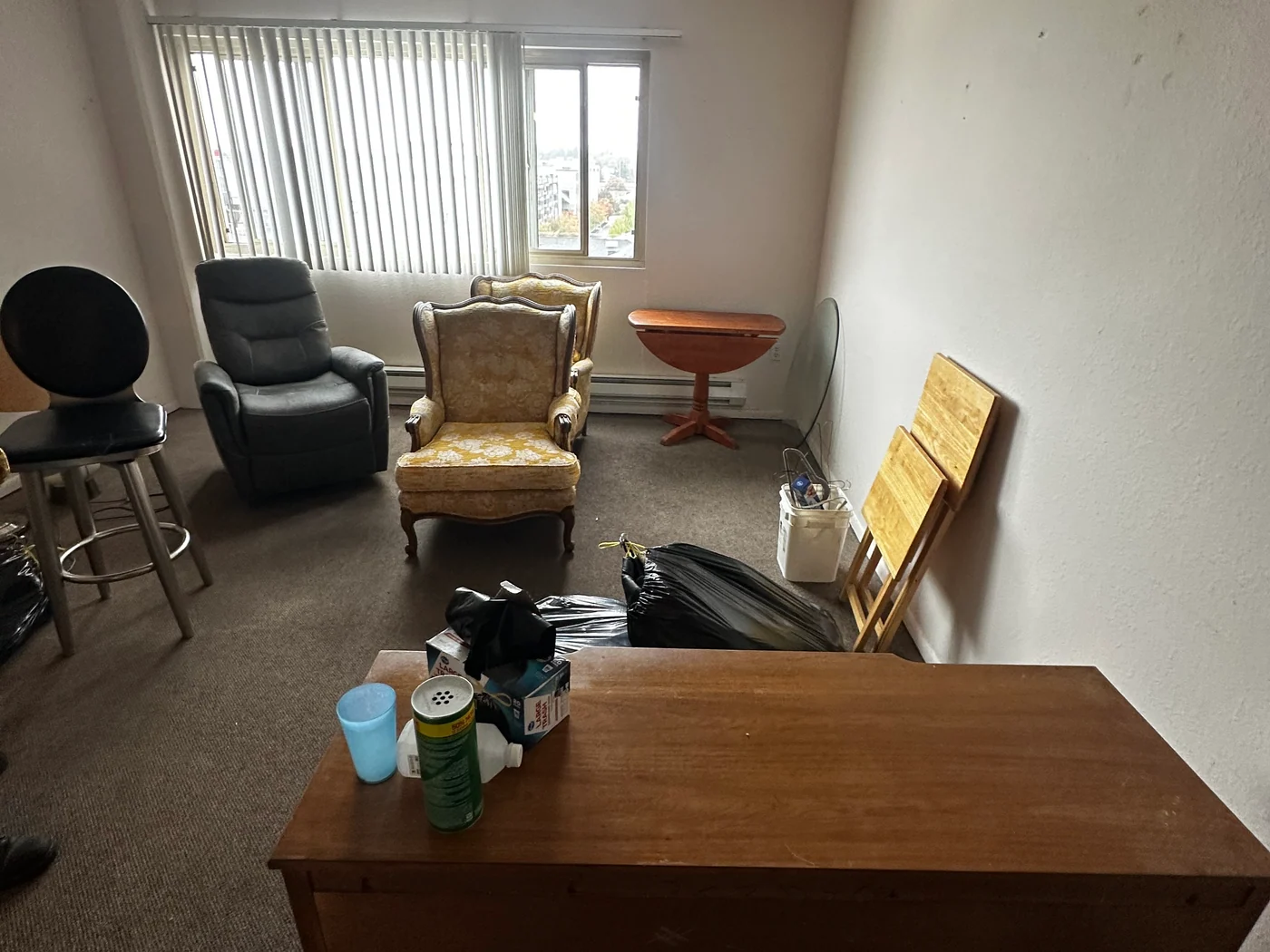 Furniture and belongings in a retirement-community room before a real Flying Flamingo cleanout.