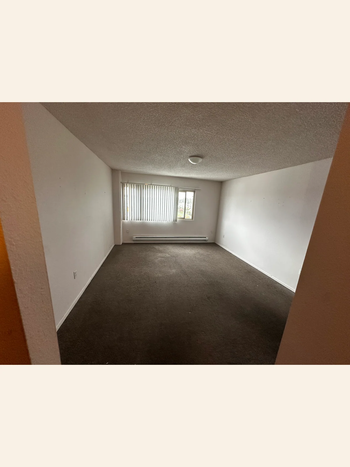 Wider view of the retirement-community room and open floor after pickup