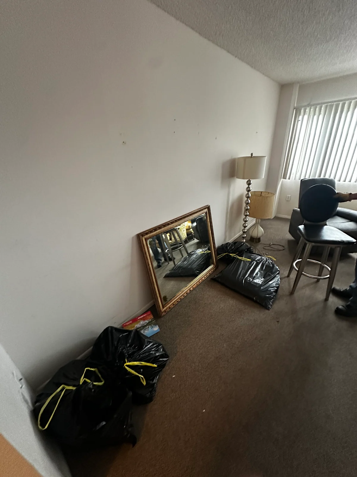 Chairs and other furniture in the retirement-community room before pickup